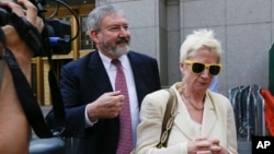 Jonathan Blackman, left, a lawyer representing Argentina, leaves federal court in New York, July 22, 2014. 