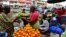 A vendor sells fruit at the large market of Adjame, a popular district of Abidjan, Ivory Coast, Aug. 10, 2017.
