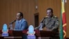 FILE - Lieutenant-General Bacha Debele of the Ethiopian National Defense Force, right, gives a joint press conference with State Minister of Foreign Affairs Redwan Hussein, in Addis Ababa, Ethiopia, June 30, 2021.