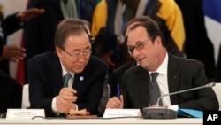 French President Francois Hollande, right, speaks with UN Secretary-General Ban Ki-moon as they attend "The Climate Challenge and African solutions" event during the COP21, the UN Climate Change Conference, in Le Bourget, north of Paris, Dec. 1, 2015.