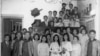 FILE - A family photo from the wedding of Hai Do's aunt, Pham Thi Nhung, center. Do's grandfather, Pham Dinh Lieu, is in front, at the far right. Do's mother, Pham Thi Loc, is to his right, in front. Hai Do is at the top of the photo, wearing glasses. 