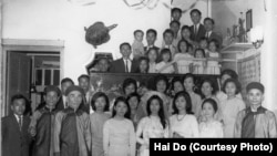 FILE - A family photo from the wedding of Hai Do's aunt, Pham Thi Nhung, center. Do's grandfather, Pham Dinh Lieu, is in front, at the far right. Do's mother, Pham Thi Loc, is to his right, in front. Hai Do is at the top of the photo, wearing glasses. 