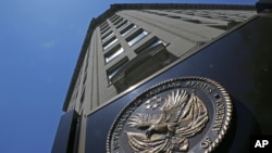 FILE - Seal affixed to the front of the Department of Veterans Affairs building in Washington, June 21, 2013.