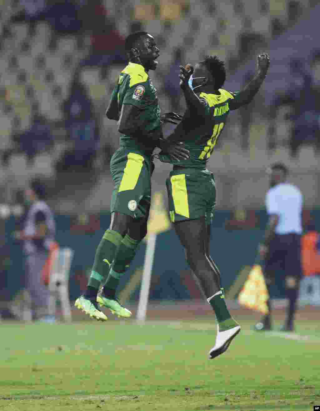 Senegalese teammates celebrate after Kouyate scored a goal against Equatorial Guinea in Cameroon, Jan. 30, 2022.