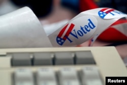 A "I Voted" sticker is shown by a keyboard in the Voting Machine Hacking Village during the Def Con hacker convention in Las Vegas, Nevada, July 29, 2017.
