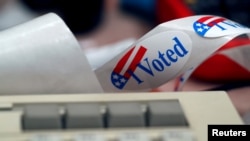 A "I Voted" sticker is shown by a keyboard in the Voting Machine Hacking Village during the Def Con hacker convention in Las Vegas, Nevada, July 29, 2017. 