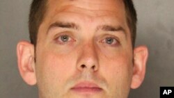 This undated photo provided by the Allegheny County District Attorney shows Michael Rosfeld, an East Pittsburgh, Pa., police officer. Rosfeld was charged with homicide Wednesday, June 27, 2018, in the shooting death of Antwon Rose Jr. after a traffic stop June 19 in East Pittsburgh. 