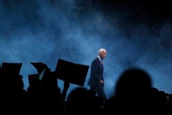 FILE - In this Nov. 1, 2019, file photo Democratic presidential candidate former Vice President Joe Biden walks on stage to speak at the Iowa Democratic Party's Liberty and Justice Celebration in Des Moines, Iowa.