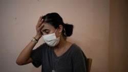 Rachelle Boumelhem reacts during an interview in her damaged beauty salon in Beirut, Lebanon, Monday, Aug. 10, 2020.