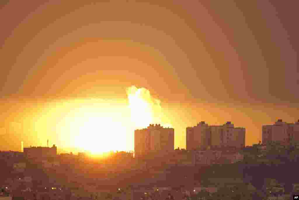 Explosion and smoke rise following an Israeli air strike in the northern Gaza Strip, seen from the Israel Gaza Border, southern Israel, Thursday, Nov. 15