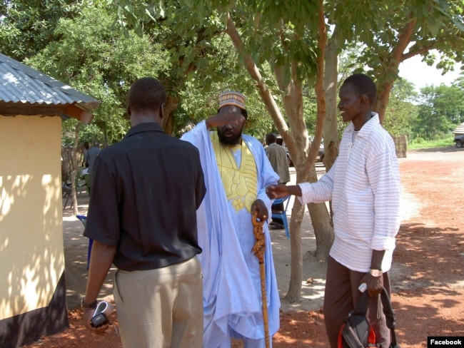 Dong Samuel Luak, at right, greeting South Sudan President Salva Kiir. (Photo: Dong's Facebook page)