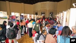 Students visit recruiters from US universities seeking answers to questions about studying abroad, at a US education fair sponsored by the US Embassy in Jakarta, April 4, 2011