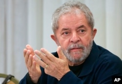 FILE - Brazil's former President Luiz Inacio Lula da Silva attends an extraordinary Worker's Party leaders meeting in Sao Paulo, March 30, 2015.