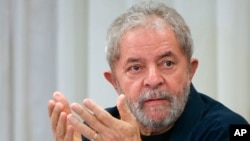 FILE - Brazil's former President Luiz Inacio Lula da Silva attends an extraordinary Worker's Party leaders meeting in Sao Paulo, March 30, 2015. 