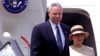 FILE - U.S. Secretary of State Colin Powell steps off the plane with his wife upon his arrival in Nairobi's Jomo Kenyatta International airport, May 26, 2001. 