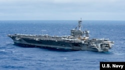 The aircraft carrier USS Carl Vinson (CVN 70) transits the Philippine Sea. The Carl Vinson Strike Group is on a regularly scheduled western Pacific deployment to extend the command and control functions of U.S. 3rd Fleet. (U.S. Navy photo by Mass Communications Specialist 3rd Class Kurtis A. Hatcher/Released)