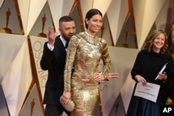 Justin Timberlake, left, and Jessica Biel arrive at the Oscars on Sunday, Feb. 26, 2017, at the Dolby Theatre in Los Angeles.