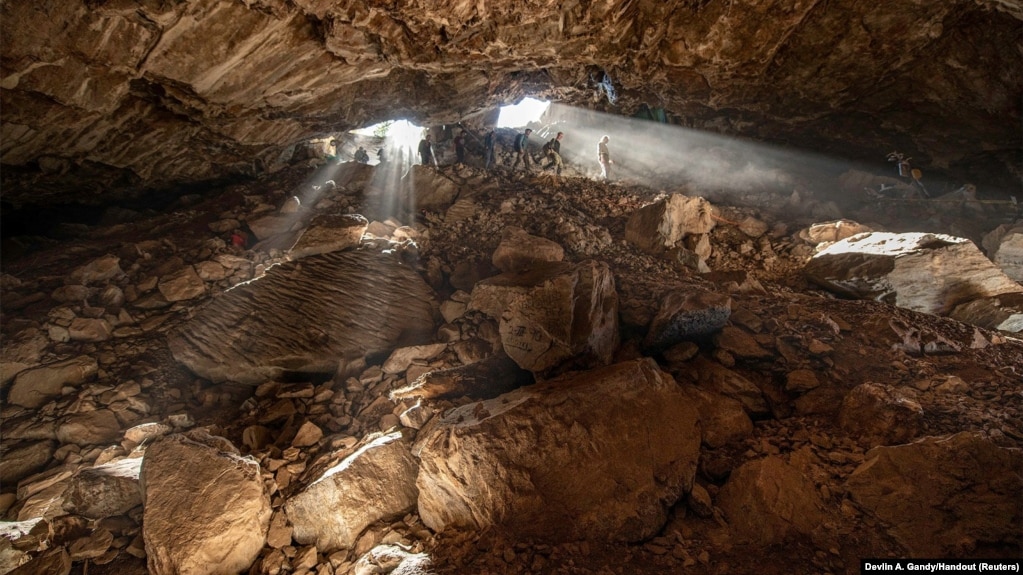 Researchers entering at a cave in Zacatecas in central Mexico, which contained stone tools and other evidence of the presence of prehistoric human populations, are seen in this image released on July 22, 2020. (Devlin A. Gandy/Handout via REUTERS)
