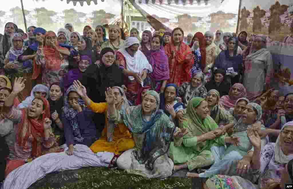 Relatives and neighbors of a Kashmiri civil service officer Naveed Jeelani wail as his body was brought home in Srinagar, India-controlled Kashmir. The bodies of Jeelani and his friend Adil Shah were retrieved from the Kolahoi Glacier in Pahalgam valley. Both of them were died while another trekker was injured as they fell in a crevice while coming down from the 4,500-meter-high Kolahoi Glacier on Sept. 7.