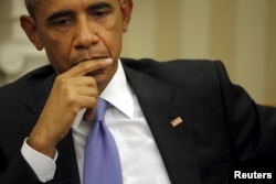 U.S. President Barack Obama listens as Spain's King Felipe VI (not pictured) talks to reporters during a visit at the White House in Washington, Sept. 15, 2015.