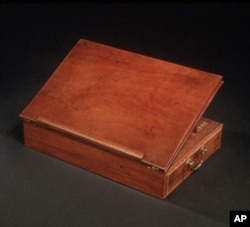 In 1776, Thomas Jefferson wrote the Declaration of Independence on this portable lap desk of his own design.