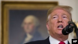 President Donald Trump speaks about the partial government shutdown, immigration and border security in the Diplomatic Reception Room of the White House, in Washington, Jan. 19, 2019.