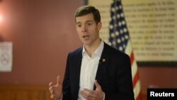 Conor Lamb gestures as he delivers a speech at his campaign rally in Houston, Pennsylvania, U.S. January 13, 2018. 