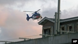 A helicopter believed to be carrying wanted war crime suspect Ratko Mladic enters the Scheveningen prison in The Hague, May 31, 2011