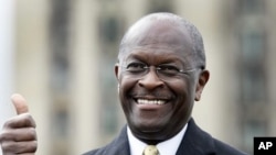 Republican Presidential candidate Herman Cain gestures to the crowd during a campaign stop in Detroit, Michigan (file photo)