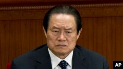 FILE - In this March 11, 2012 file photo, Zhou Yongkang, then Chinese Communist Party Politburo Standing Committee member in charge of security, attends a plenary session of the National People's Congress at the Great Hall of the People in Beijing, China.