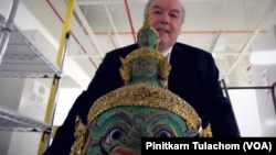 Director of the Smithsonian's A.C.H.P.,Dr. Paul Michael Taylor carries a Thai Khon mask 'Thotsakan' at the Smithsonian Museum Support Center, Suitland, MD. June 28, 2018.