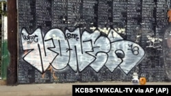 Graffiti is shown on a Vietnam War memorial in the Venice area of Los Angeles, May 27, 2016. The memorial lists the names of American service members missing in action or unaccounted for in Southeast Asia, painted by a Vietnam veteran and dedicated in 199
