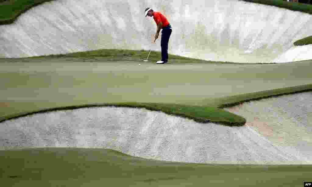 Joost Luiten of the Netherlands plays a shot during the final round of the DP World Tour Golf Championship in the Gulf emirate of Dubai.