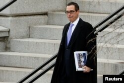 Incoming Trump administration Treasury Secretary nominee Steven Mnuchin departs after working a simulated crisis scenario during transition meetings at the Eisenhower Executive Office Building at the White House in Washington, Jan. 13, 2017.