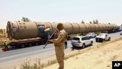 De nouvelles équipements arrivent à la raffinerie de Kalak, Irak, le 14 juillet 2014.