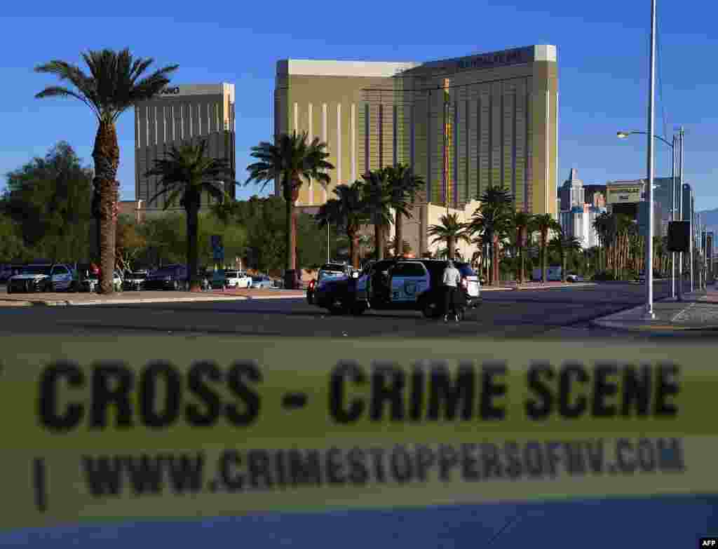 Crime scene tape surrounds the Mandalay Hotel (background) after a gunman killed at least 50 people and wounded more than 200 others when he opened fire on a country music concert in Las Vegas, Nevada, Oct. 2, 2017.