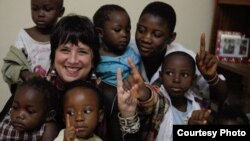 Eve Ensler with children from the City of Joy community, February 2013. (Paula Allen)