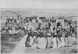 Shoshone Indians at Ft. Washakie, Wyoming Indian Reservation. Chief Washakie (L) Extends His Right Arm, 1892