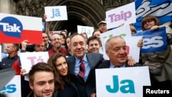 Scotland's First Minister Alex Salmond, center, poses with supporters of the "Yes Campaign" in Edinburgh, Scotland, Sept. 9, 2014. 
