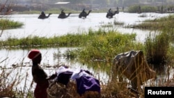 FILE - Nigerians fleeing Boko Haram attacks continue to enter Chad, at Lake Chad at Ngouboua.
