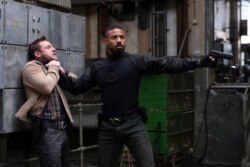 Jamie Bell (kiri) dan Michael B. Jordan dalam sebuah adegan dari "Tom Clancy's Without Remorse." (Nadja Klier / Amazon via AP)