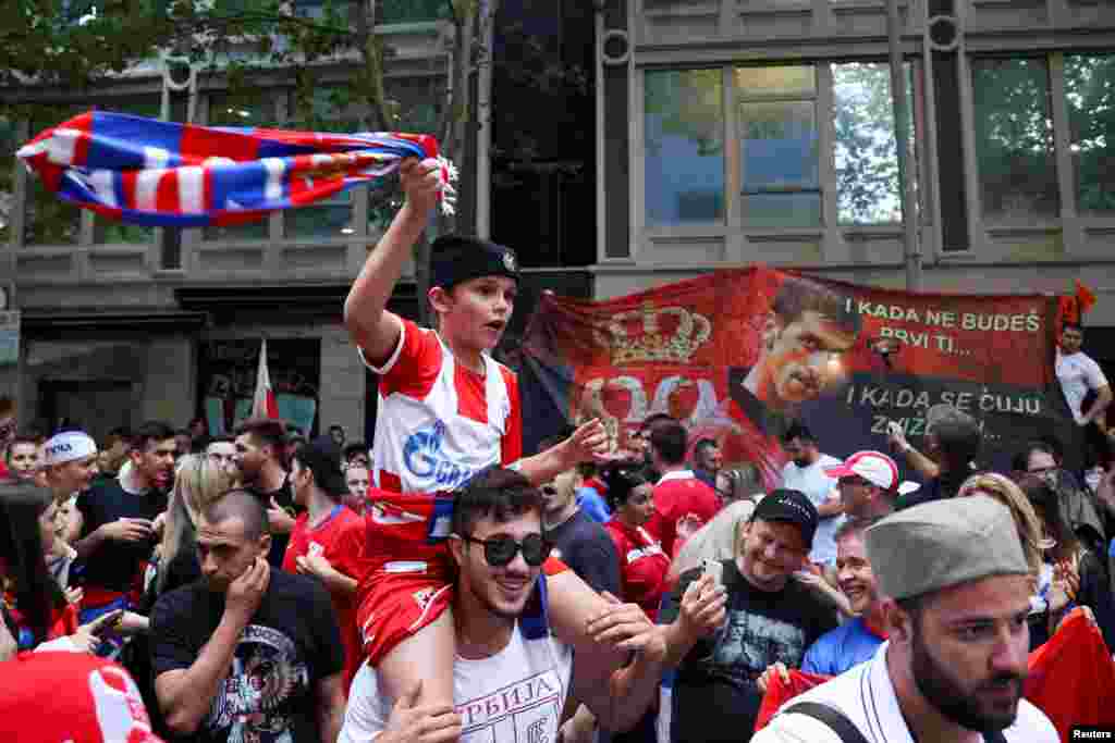 Supporters of Serbian tennis player Novak Djokovic rally in the street outside what is believed to be the location of his lawyer&#39;s office during an ongoing day of legal proceedings over the cancellation of his visa to play in the Australian Open in Melbourne.