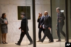 President of the European Parliament Martin Schultz, second from right, arrives at the Maltese parliament to delivers a speech on the occasion of a migration summit in Valletta, Malta, Tuesday, Nov. 10, 2015.