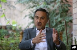 Mohammad Daud Sultanzoy, a former lawmaker overseeing the handover of military airports for the Afghan government, speaks during an interview with the Associated Press in Kabul, Afghanistan, Aug 18, 2015.