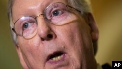 FILE - Senate Majority Leader Mitch McConnell, R-Ky., makes a statement to reporters at the Capitol in Washington, where he reminded GOP presidential candidate Donald Trump that the Republican Party does not support bigotry or racism, March 1, 2016.
