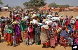 FILE - Somalis displaced by the drought, arrive at makeshift camps in the Tabelaha area on the outskirts of Mogadishu, Somalia, March 30, 2017.