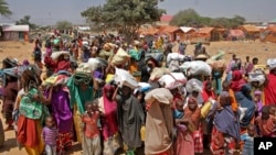 FILE - Somalis displaced by the drought, arrive at makeshift camps in the Tabelaha area on the outskirts of Mogadishu, Somalia, March 30, 2017. 