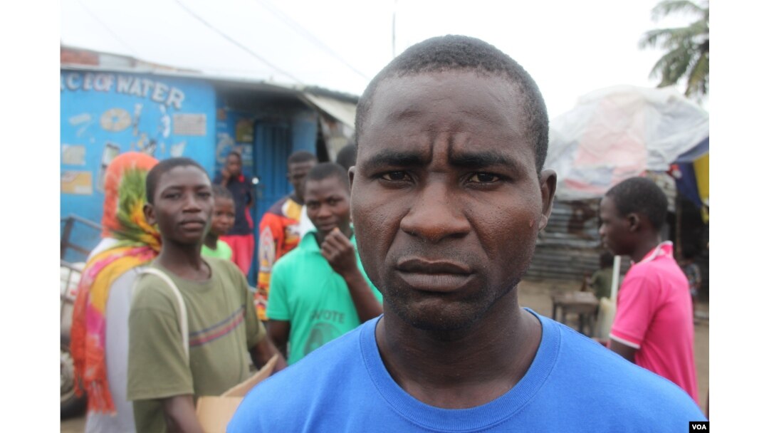 Robert Sayon, who lives in West Point, says many live in fear of contracting ebola which impacts an already stressful life in one of Monrovia's poorest districts, Monrovia, Liberia, Sept. 25, 2014. (Benno Muchler /VOA)