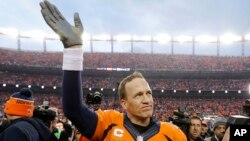 FILE - Denver Broncos quarterback Peyton Manning waves to spectators following the AFC Championship game between the Denver Broncos and the New England Patriots, in Denver, Jan. 24, 2016. 