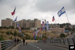 Security officers walk on a road leading to the U.S. Embassy compound ahead the official opening in Jerusalem, May 13, 2018.
